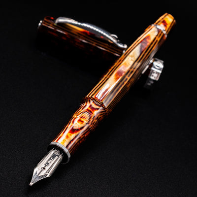 Close-up of the nib and patterned brown arco barrel of the preowned Omas Grand Paragon fountain pen