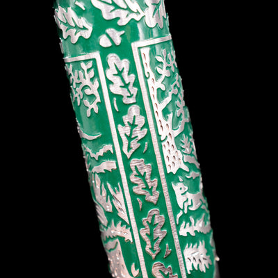 Wraparound view of the engraved silver hunting scene on the barrel of the Pelikan M915 Hunting Fountain Pen
