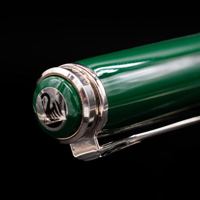 Close-up of a bird engraved in silver on the cap of the Pelikan M915 Hunting Fountain Pen