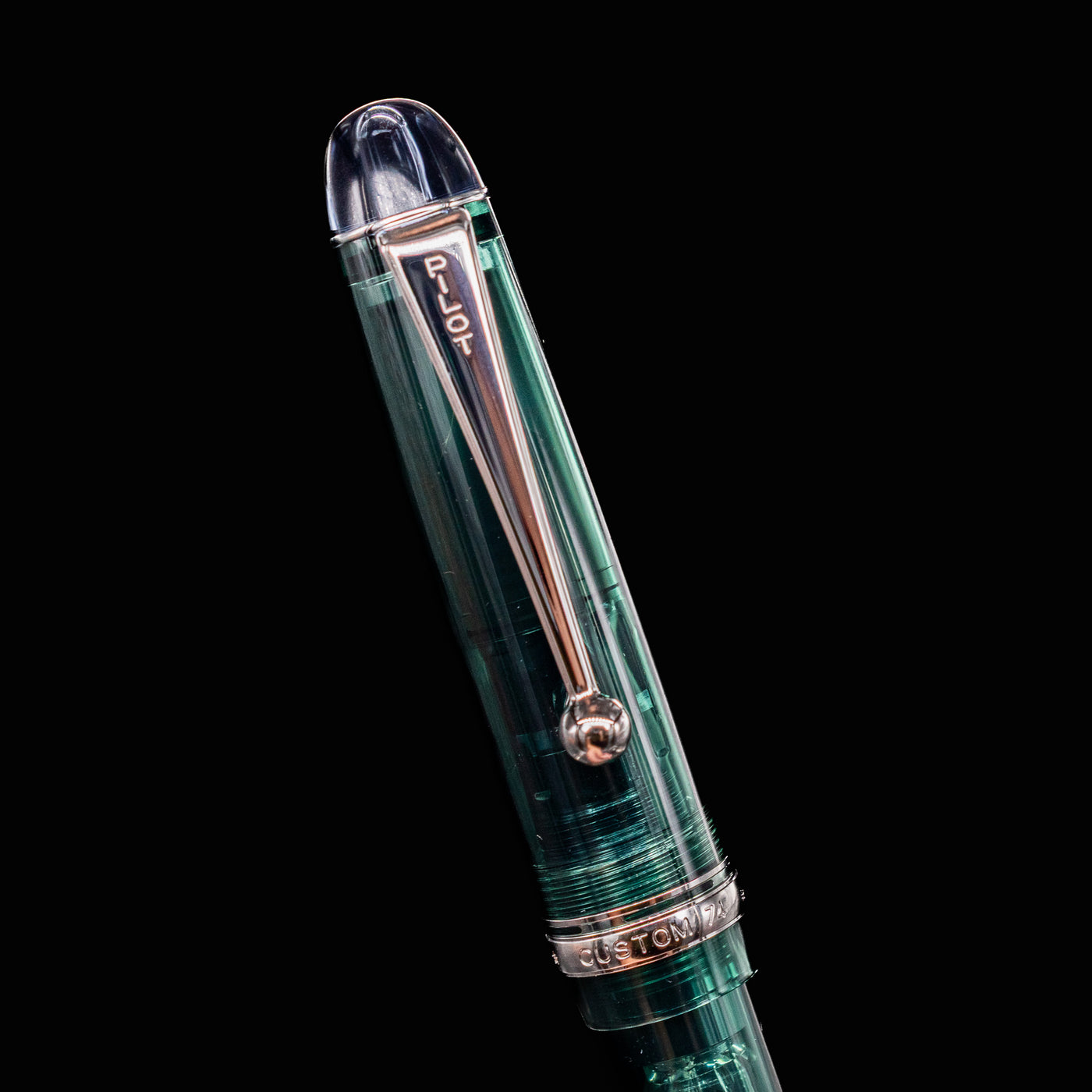 Detailed view of Pilot Custom 74 Forest Green pen clip and custom-74 engraving on cap band