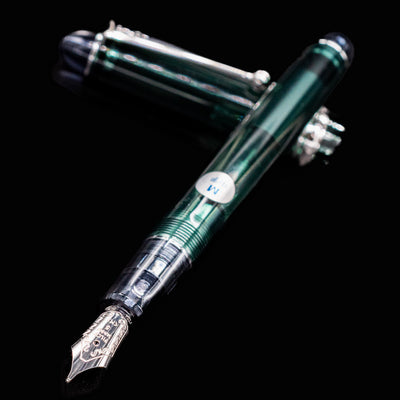 Pilot Custom 74 Forest Green fountain pen uncapped with cap beside it