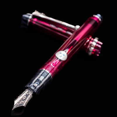 Close-up of the Pilot Custom 74 Merlot fountain pen showing fine nib and transparent burgundy barrel