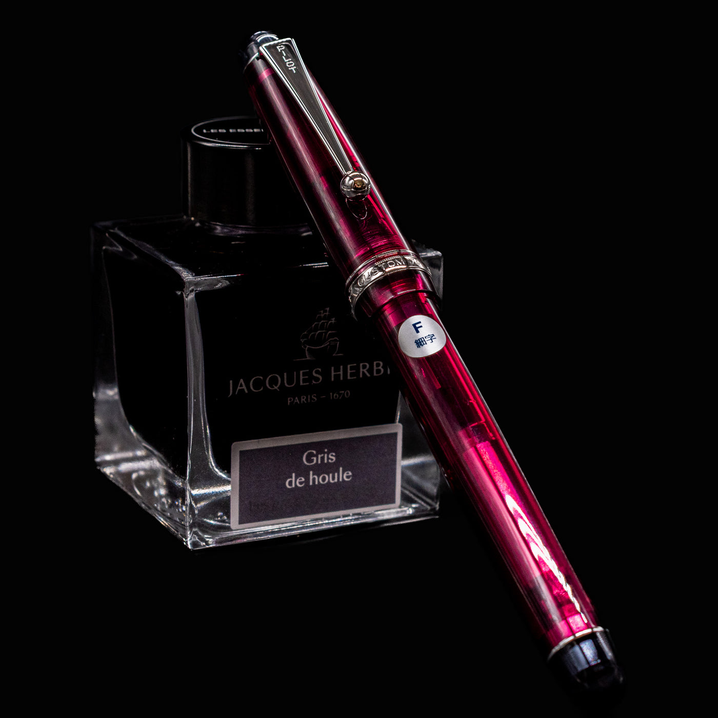 Pilot Custom 74 Merlot fountain pen with fine nib clipped to Jacques Herbin Gris de Houle ink bottle