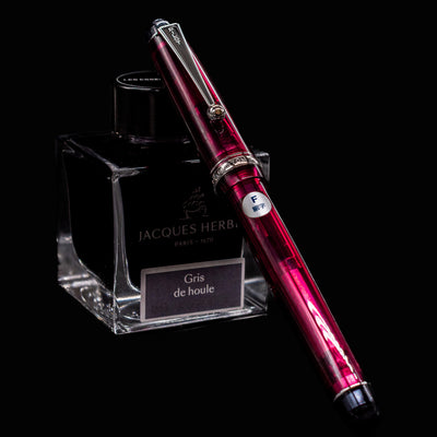 Pilot Custom 74 Merlot fountain pen with fine nib clipped to Jacques Herbin Gris de Houle ink bottle