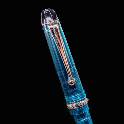 Close-up of the teal cap of the Pilot Custom 74 Fountain Pen featuring silver clip and finial