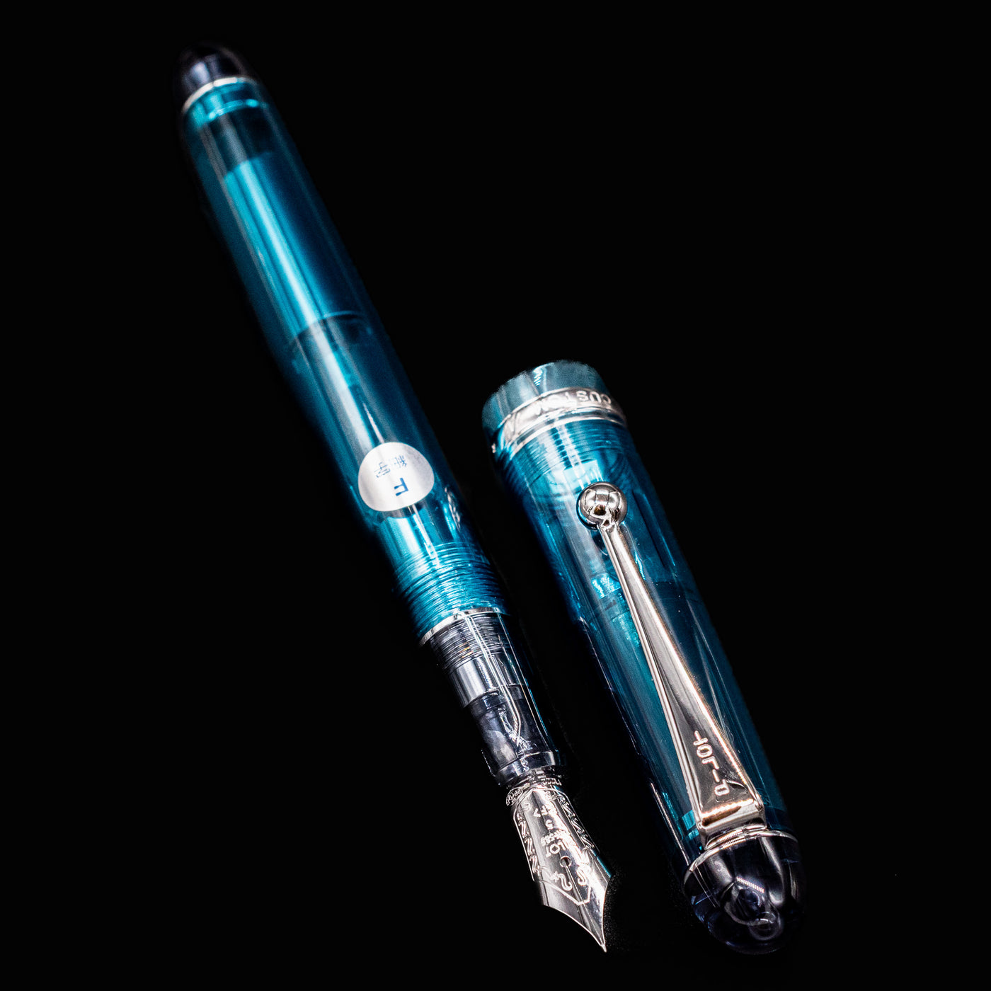 Pilot Custom 74 Teal Fountain Pen with cap off showing full transparent barrel and nib