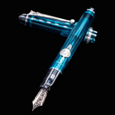 Close-up of Pilot Custom 74 Teal Fountain Pen nib and transparent grip section