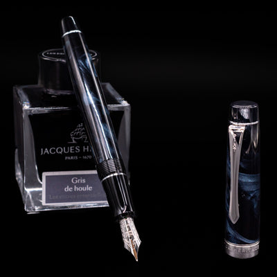 Pilot Custom Heritage SE Fountain Pen in Blue Marble shown uncapped at an angle, displaying marbled resin body and silver trim.