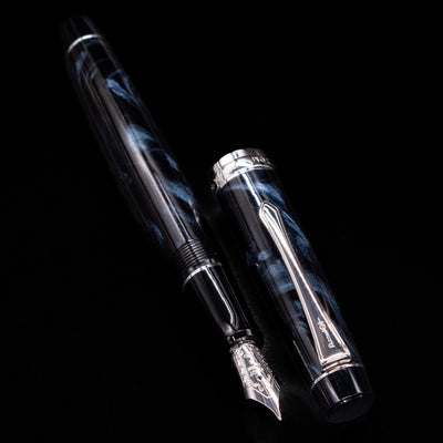 Detail of the cap on the Pilot Custom Heritage SE Fountain Pen in Blue Marble showing marbled resin and silver clip.