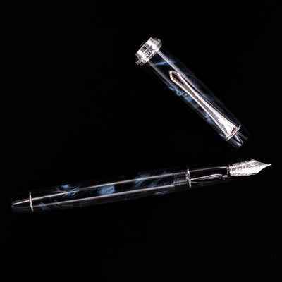 Flatlay of the capped Pilot Custom Heritage SE Fountain Pen in Blue Marble with full view of pen body.