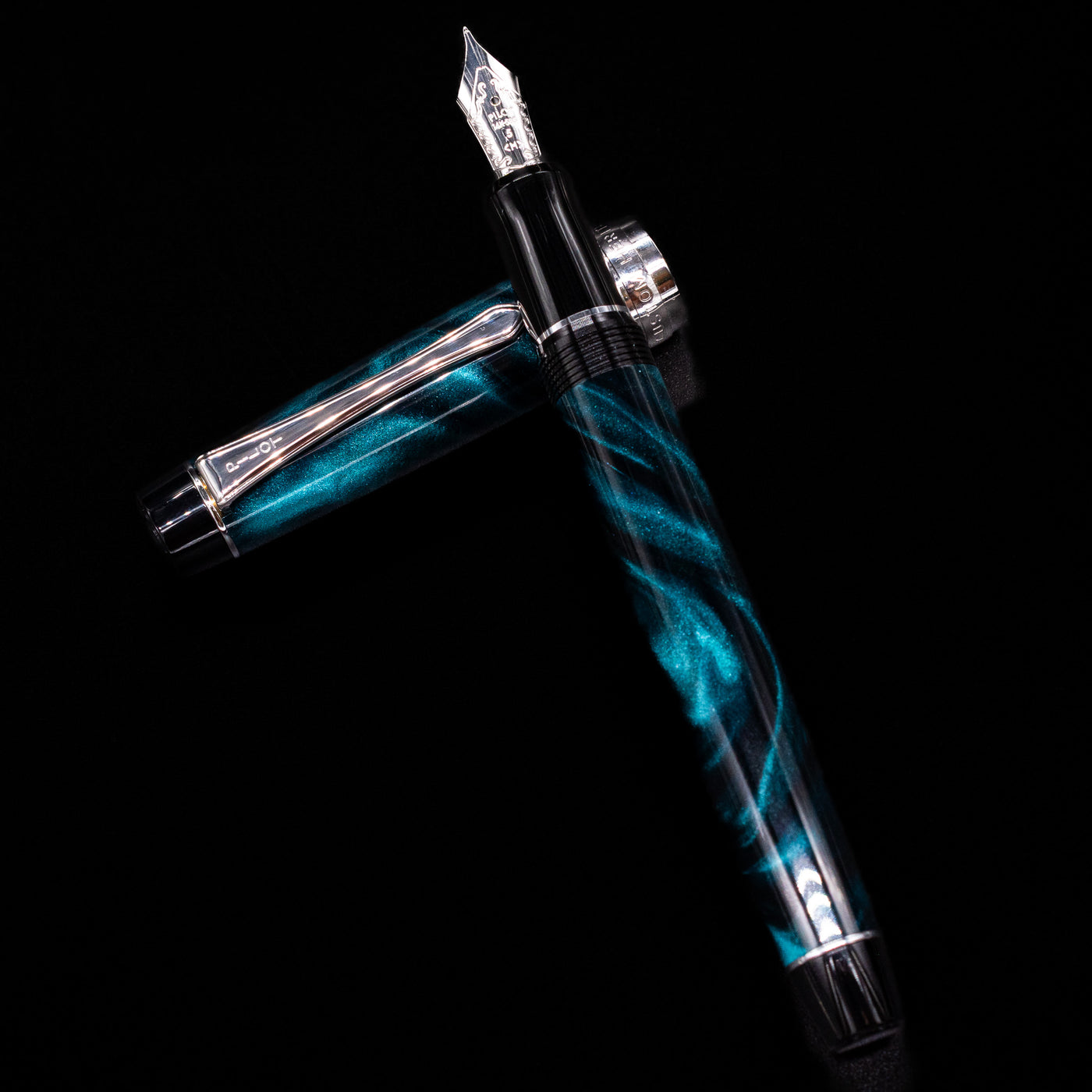 Flatlay of the uncapped Pilot Custom Heritage SE Green Marble Fountain Pen angled diagonally on black background