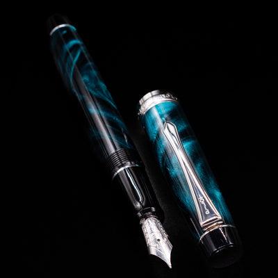 Pilot Custom Heritage SE Green Marble Fountain Pen with body and cap laid separately on black surface