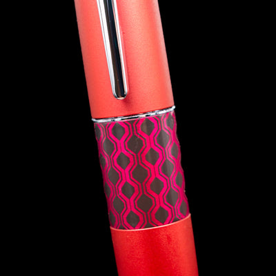 Close-up of the Pilot Metropolitan Pop Ballpoint Pen in red showing the geometric pop art design on the center band.