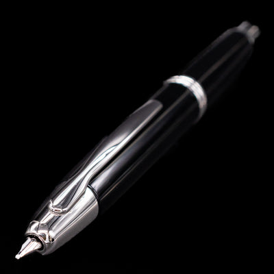 Close-up image of the nib and clip of the Pilot Vanishing Point Decimo Fountain Pen in Black and Rhodium on black background