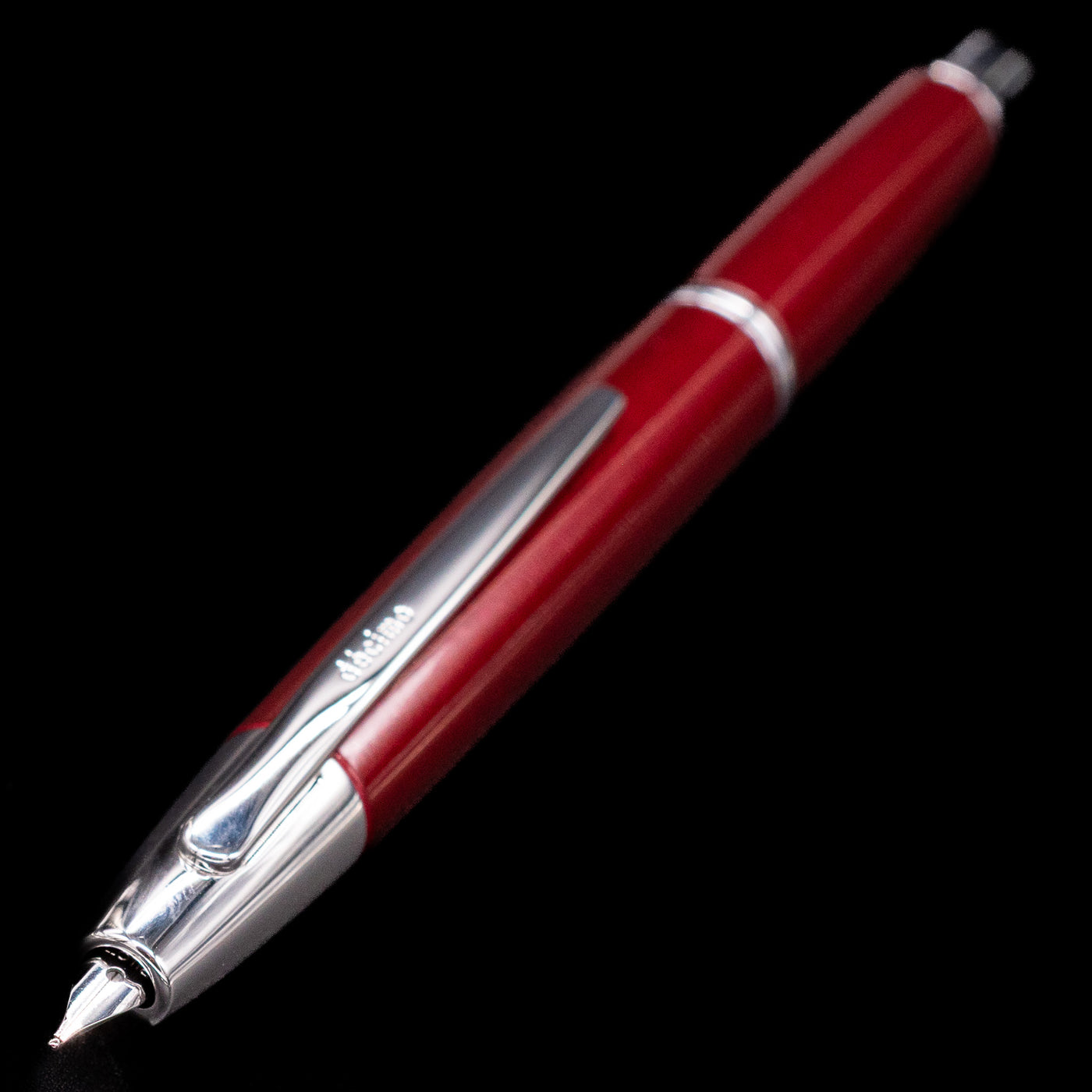 Close-up of Pilot Vanishing Point Decimo Burgundy Fountain Pen showing retractable nib and chrome clip