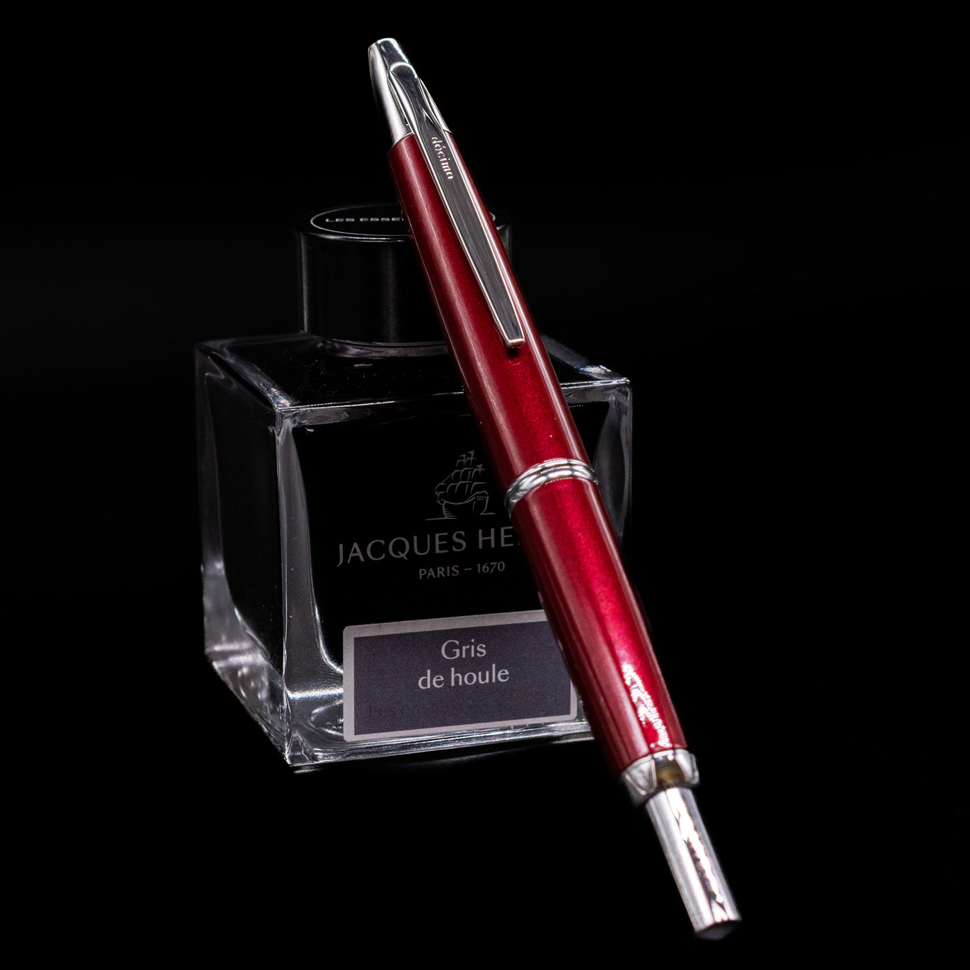 Pilot Vanishing Point Decimo Burgundy Fountain Pen displayed on Jacques Herbin ink bottle showing clip and silver trim