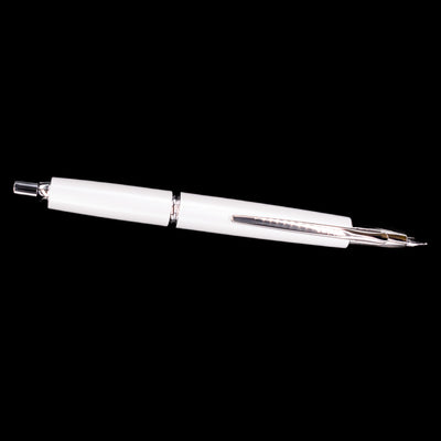 Full-length view of Pilot Vanishing Point Decimo Fountain Pen in White with nib extended on black background