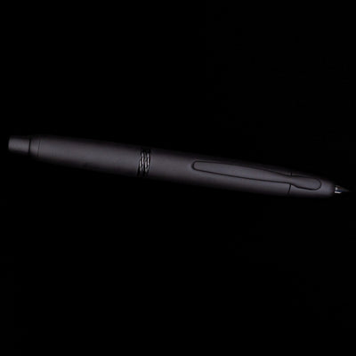 Side view of Pilot Vanishing Point Fountain Pen in Black Matte with nib extended on black background