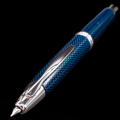 Close-up of Pilot Vanishing Point Blue Carbonesque fountain pen clip and textured barrel