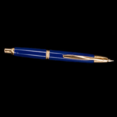 Full side view of the Pilot Vanishing Point Fountain Pen in Blue with Gold Trim showing nib extended and body details