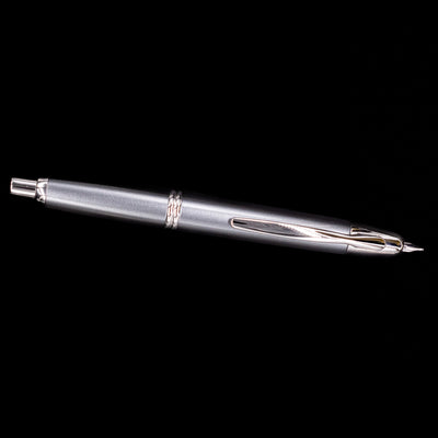 Full-length view of the Pilot Vanishing Point Fountain Pen in Gun Metal with nib extended against black background