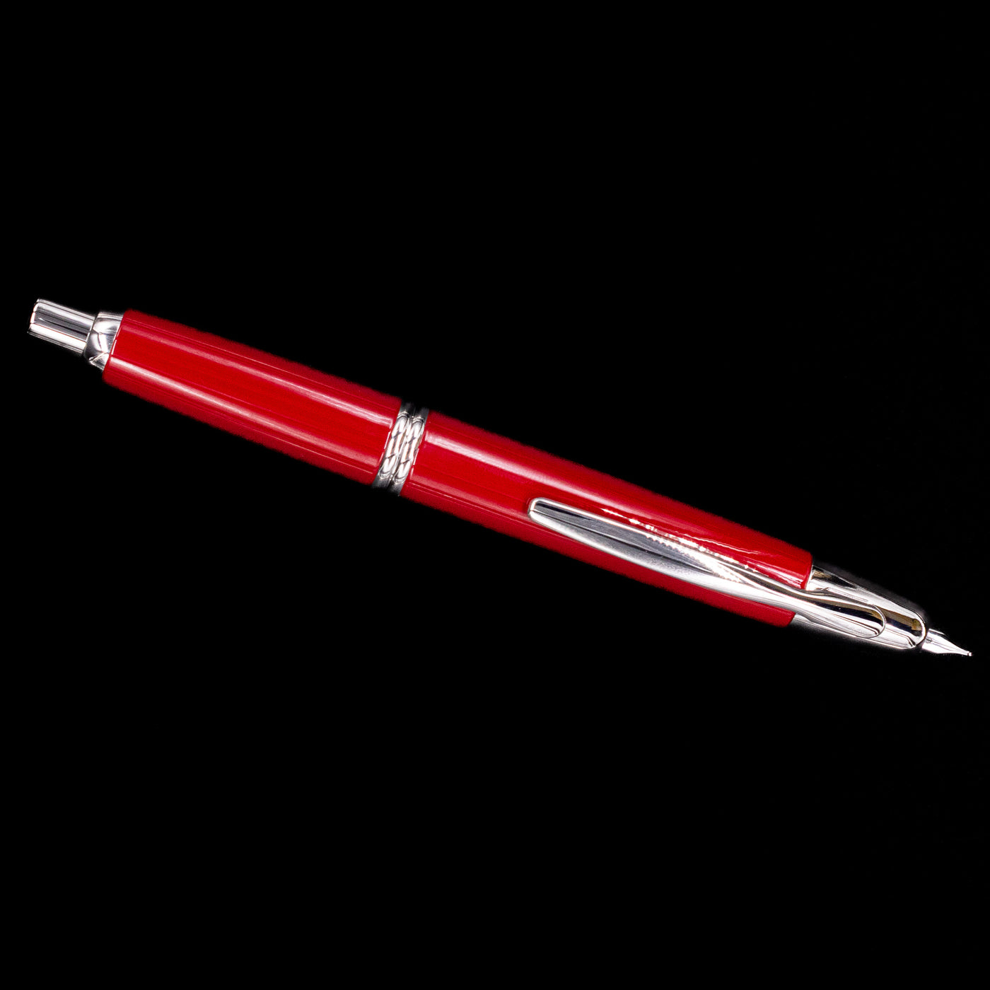 Full-length top view of the Pilot Vanishing Point Fountain Pen in Red with Rhodium Trim against black background