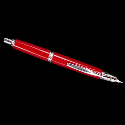 Full-length top view of the Pilot Vanishing Point Fountain Pen in Red with Rhodium Trim against black background