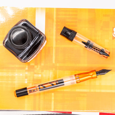 Pineider Mystery Fast Filler Fountain Pen - Orange (14k Nib) uncapped