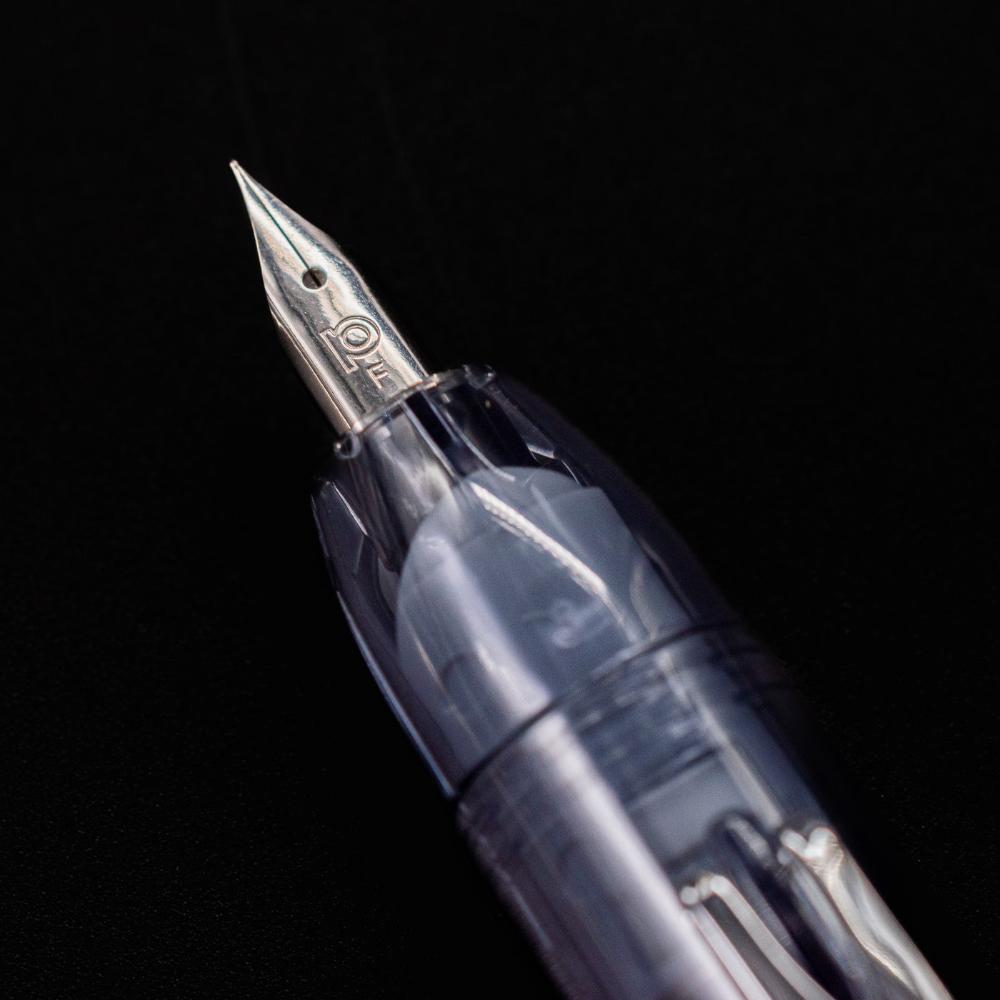 Close-up of the extra fine stainless steel nib on the Platinum Curidas Fountain Pen - Graphite Smoke.