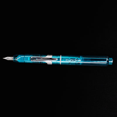 Full side view of the Platinum Curidas Fountain Pen - Urban Green with its cap retracted and nib extended.
