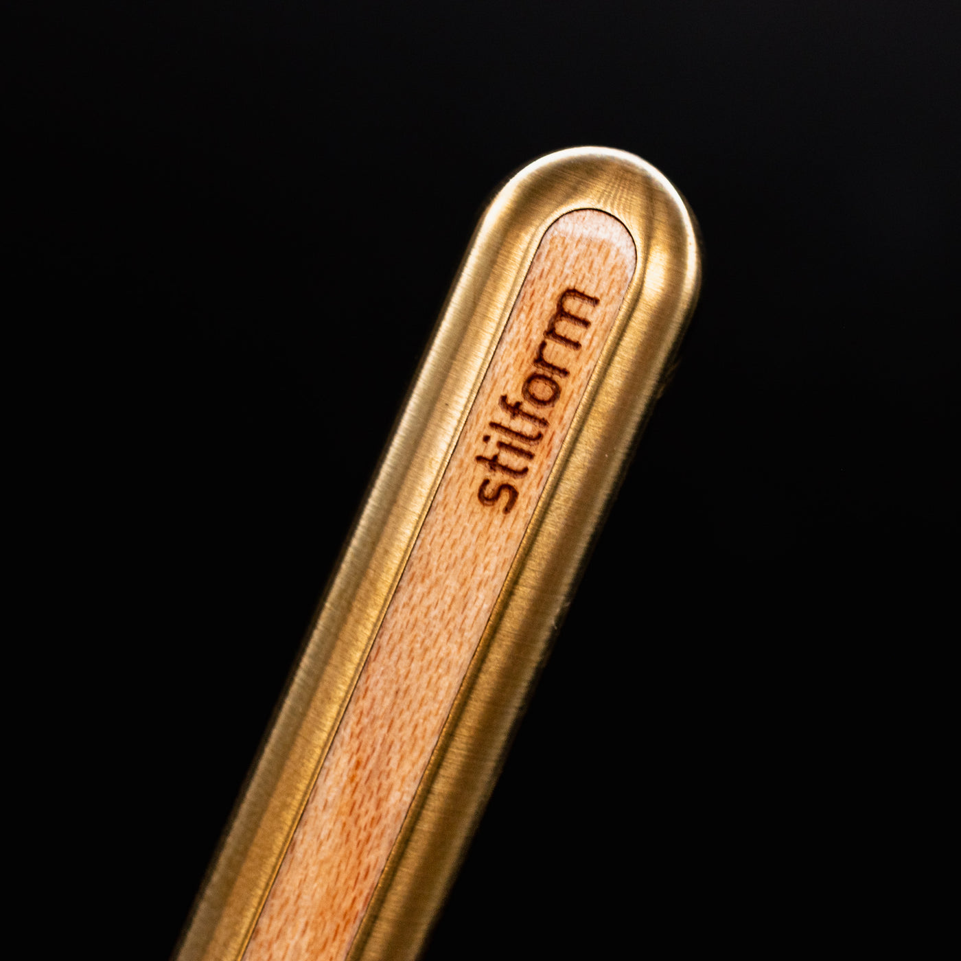 Stilform AEON Pencil Brass with Maple Veneer - closeup of Stilform logo on barrel