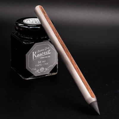 Stilform AEON Pencil Titanium Matte - leaning on ink bottle