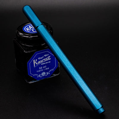 Stilform ARC Gel Pen Night Sky Aluminum - capped and leaning on ink bottle