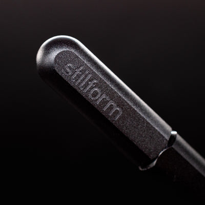 Stilform ARC Gel Pen Titanium DLC - closeup of Stilform logo on barrel