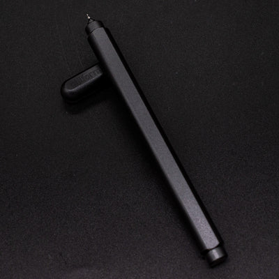 Stilform ARC Gel Pen Titanium DLC - barrel leaning on cap, uncapped view