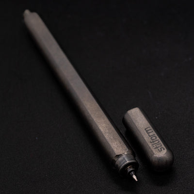 Stilform ARC Gel Pen Titanium Matte - uncapped angled view from overhead