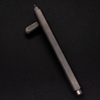Stilform ARC Gel Pen Titanium Matte - barrel leaning on cap, uncapped view