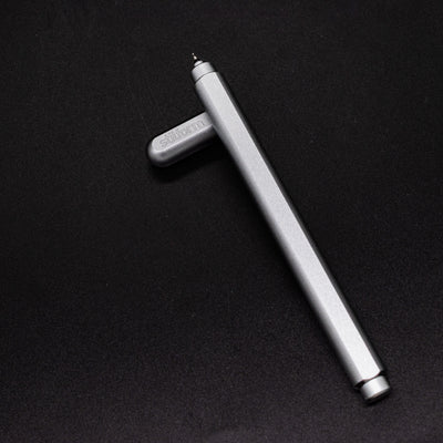Stilform ARC Gel Pen Warp Black - barrel leaning on cap, uncapped view