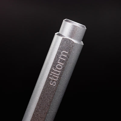 Stilform FLOW Rollerball Pen Comet Grey- closeup of Stilform logo on barrel