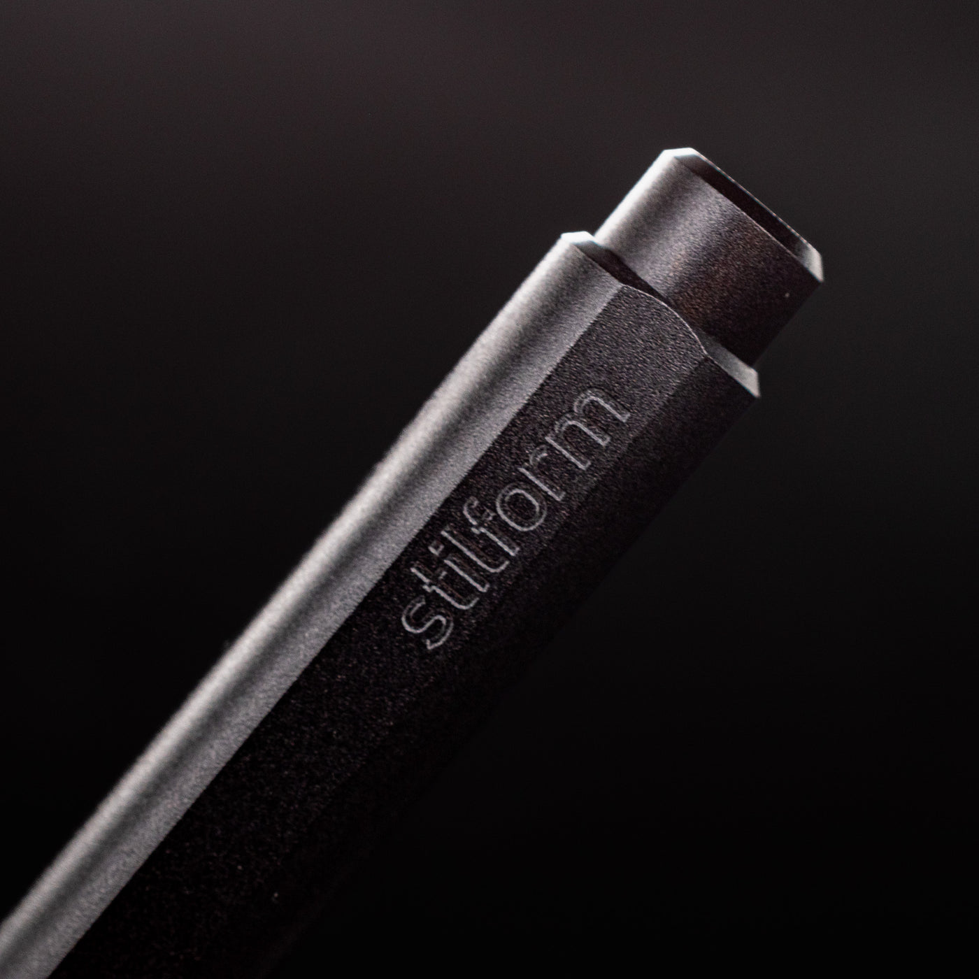 Stilform FLOW Rollerball Pen Warp Black - closeup of Stilform logo on barrel