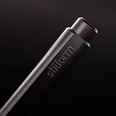 Stilform FLOW Rollerball Pen Warp Black - closeup of Stilform logo on barrel