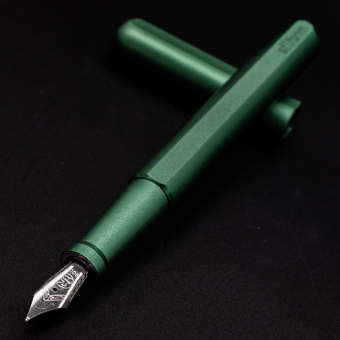 Stilform INK Fountain Pen Aurora Green – nib closeup, uncapped and leaning toward camera