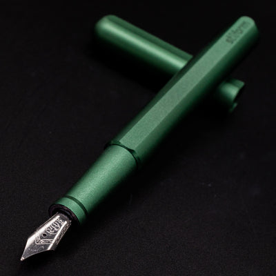 Stilform INK Fountain Pen Aurora Green – nib closeup, uncapped and leaning toward camera