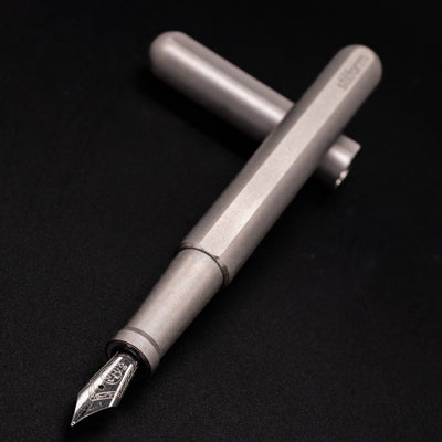 Stilform INK Fountain Pen Comet Grey – nib closeup, uncapped and leaning toward camera