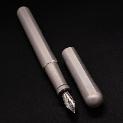 Stilform INK Fountain Pen Comet Grey – uncapped angled view from overhead