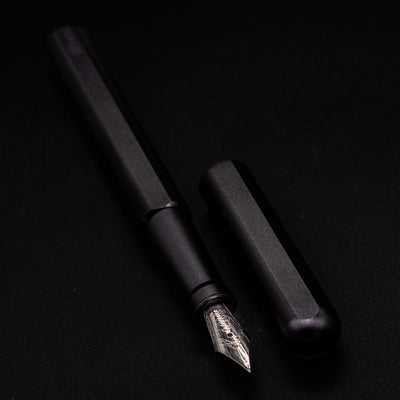 Stilform INK Fountain Pen Titanium DLC – uncapped angled view from overhead
