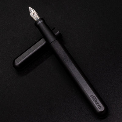 Stilform INK Fountain Pen Titanium DLC – barrel leaning on cap, uncapped view
