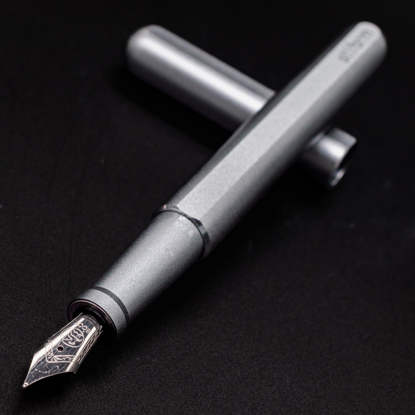Stilform INK Fountain Pen Warp Black – nib closeup, uncapped and leaning toward camera