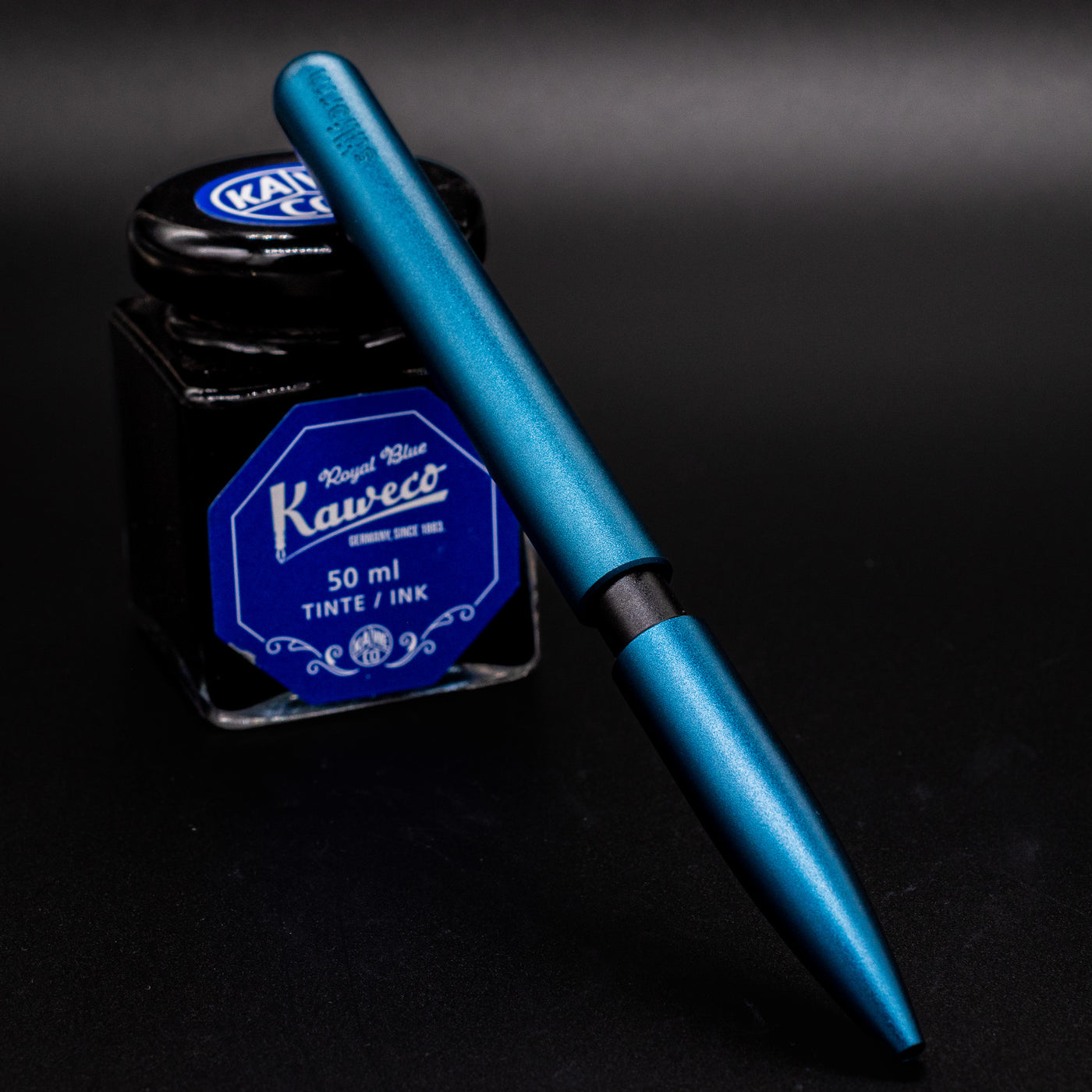 Stilform PEN Ballpoint Pen Night Sky Aluminum - pen leaning on ink bottle