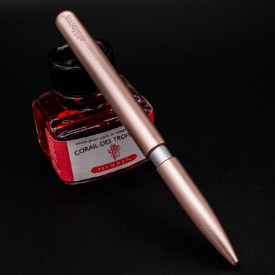 Stilform PEN Ballpoint Pen Rose Moon Aluminum - pen leaning on ink bottle